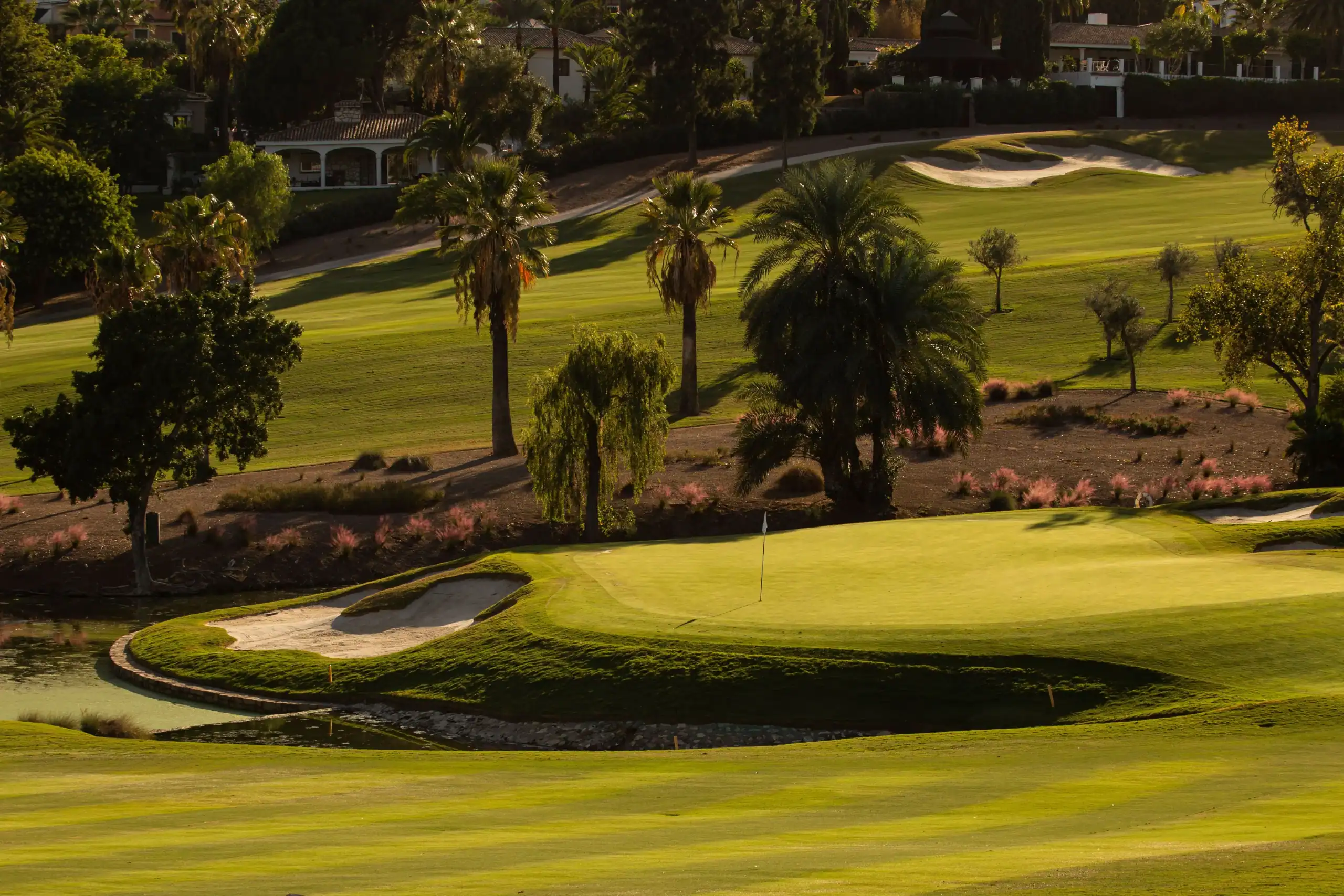 Beautiful golf course in Marbella with lush greens and scenic views.