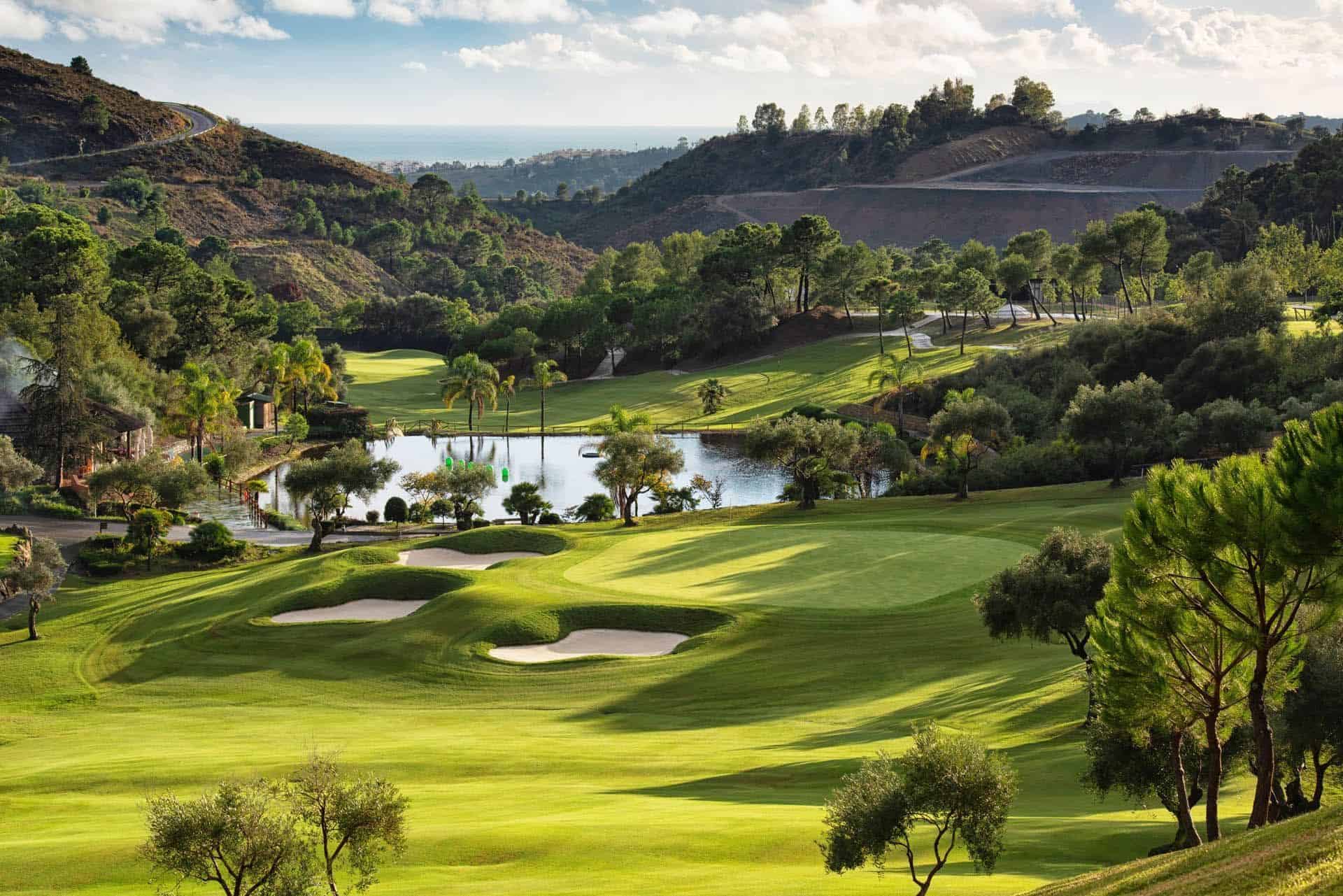 Beautiful golf course in Marbella with lush greens and scenic views.